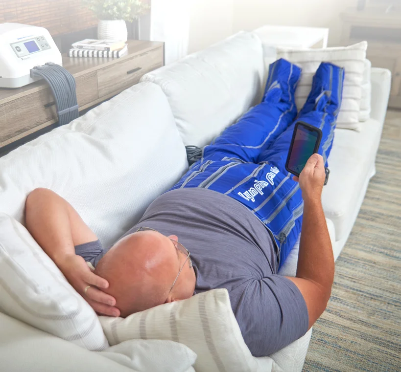 A person wearing an inflatable pneumatic compression garment; representative model, not confirmed practice equipment