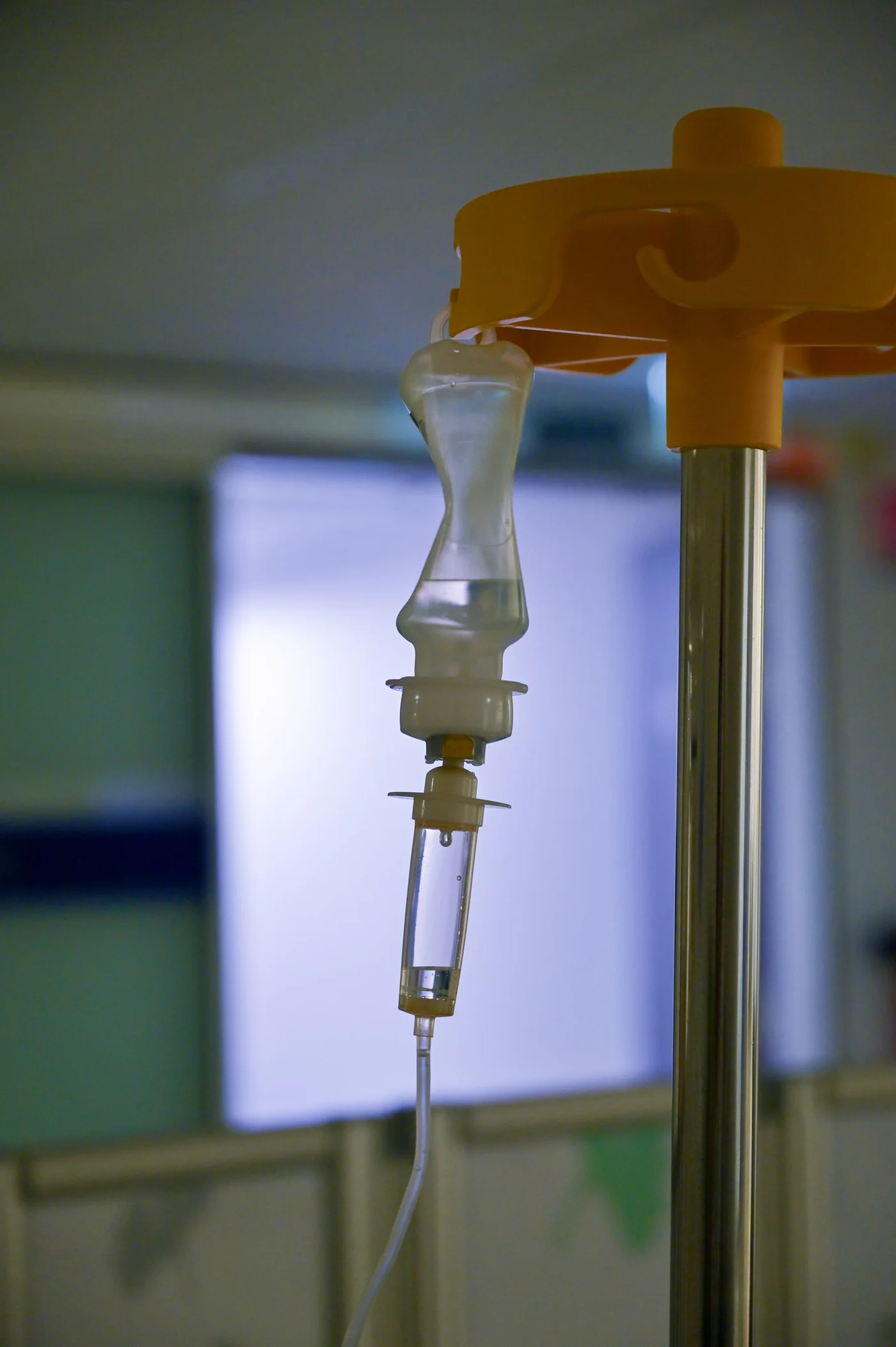 Close-up of an intravenous drip chamber and delivery tubing