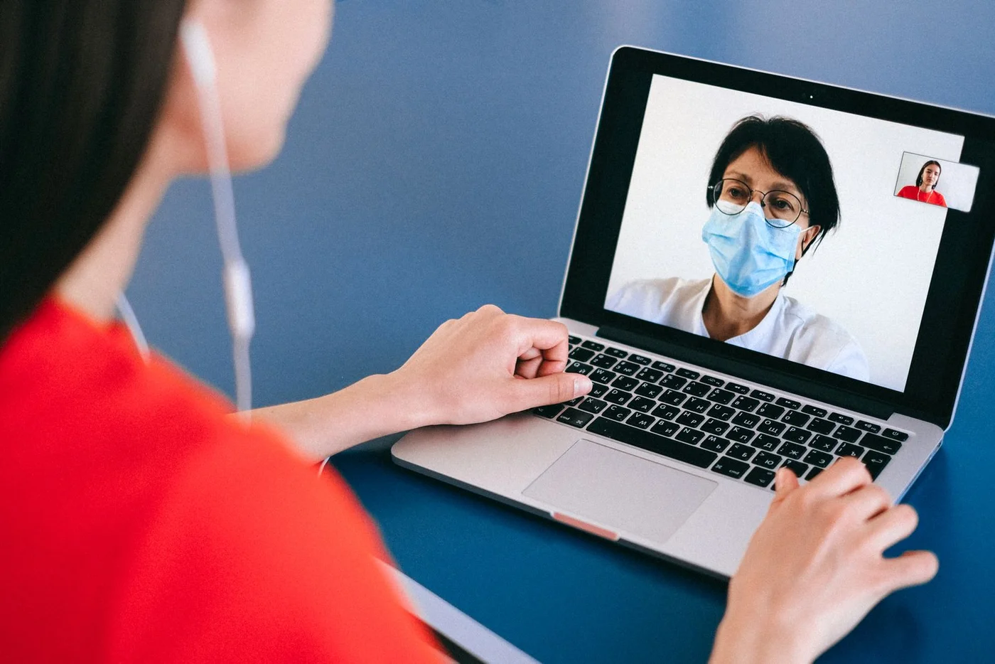 Patient using a laptop for a video conversation with a clinician